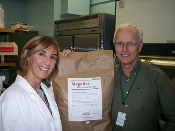 Gordon and Fabiana holding up the first official bag of MegaBee ever made